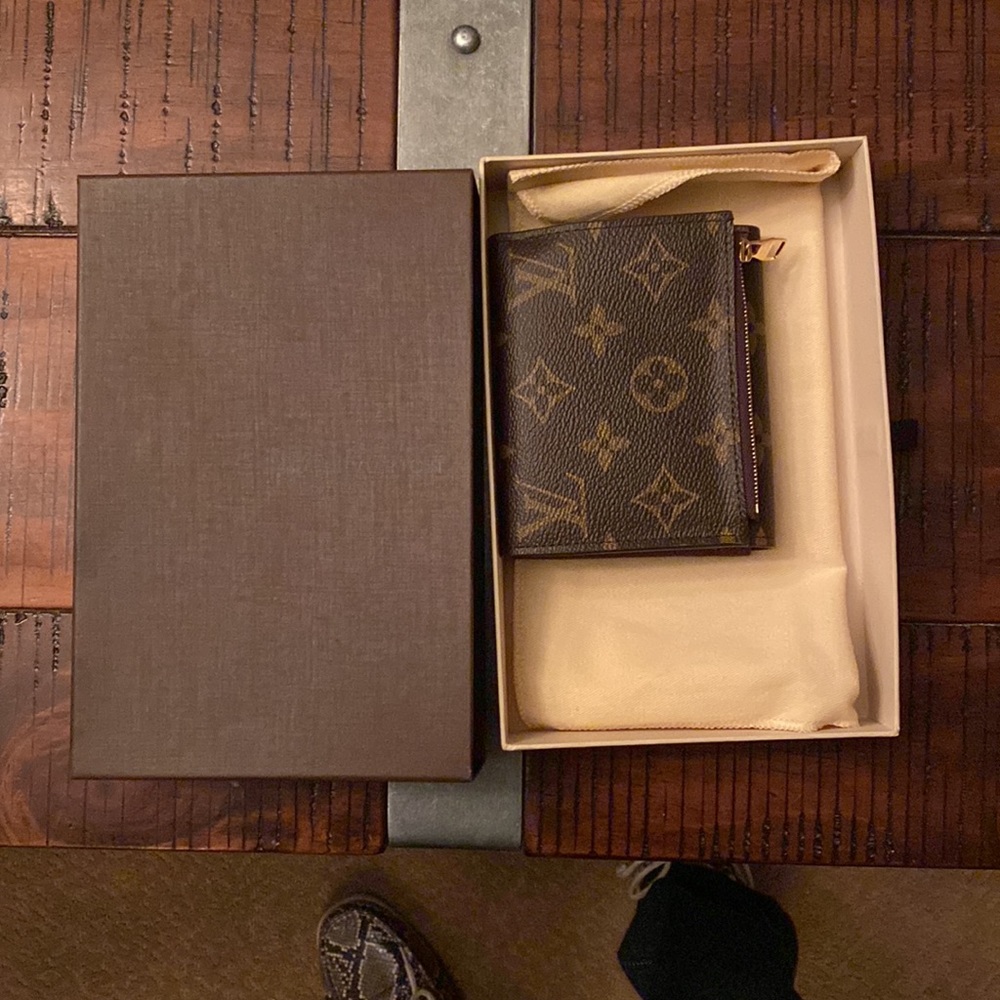 Louis Vuitton folding wallet. Outside zipper, unused, in original packaging